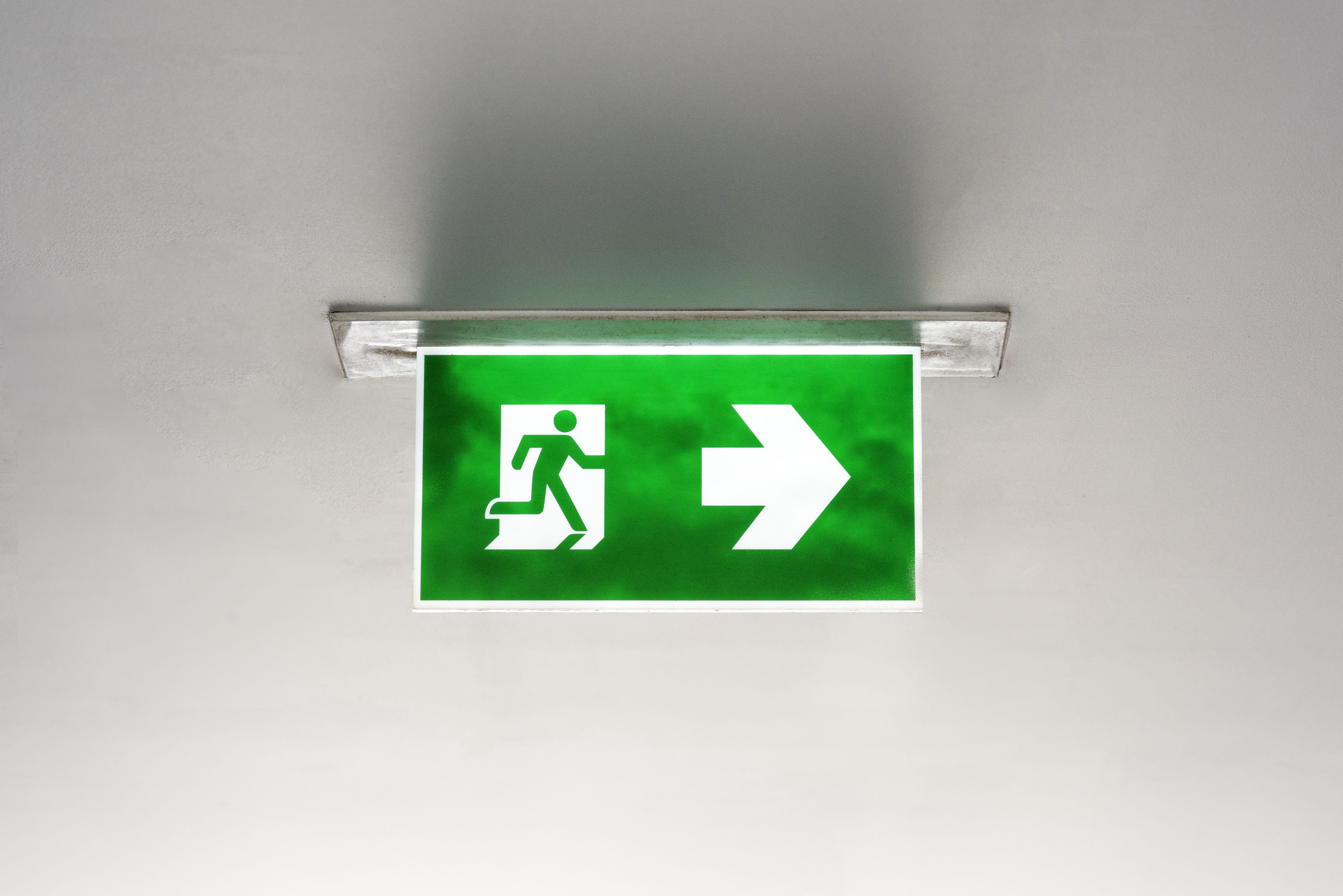 green-emergency-exit-sign-ceiling